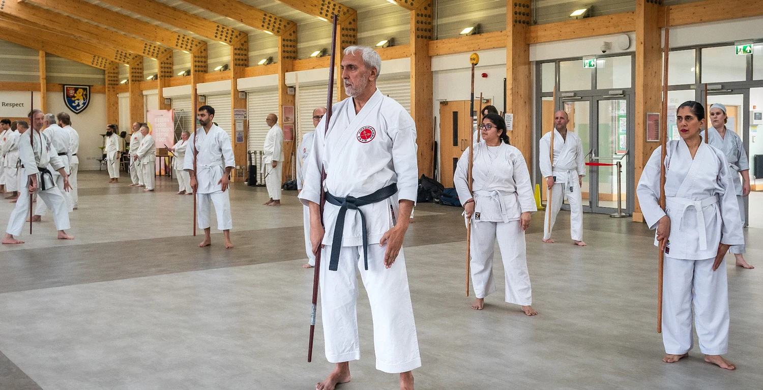 Students practising Bo together in a training hall