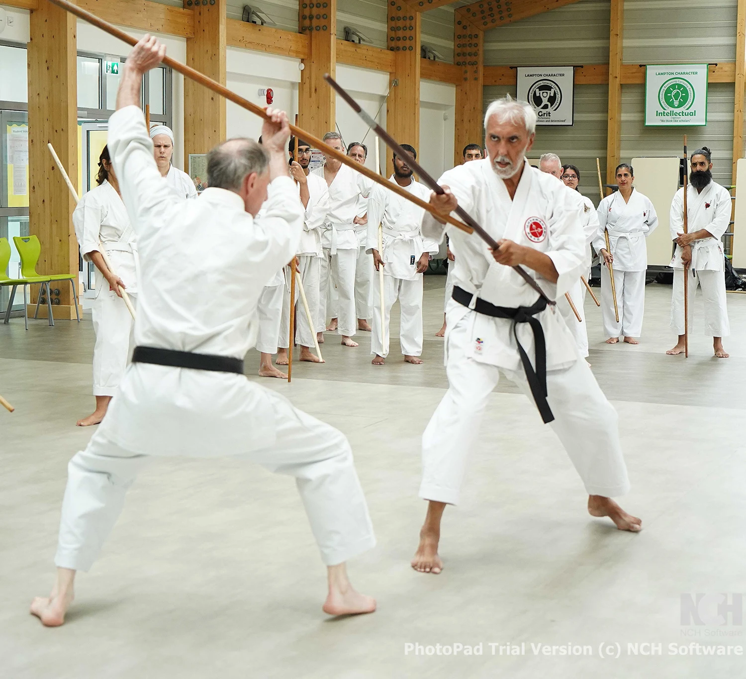 Kobujutsu: two practitioners working on distance with Bo