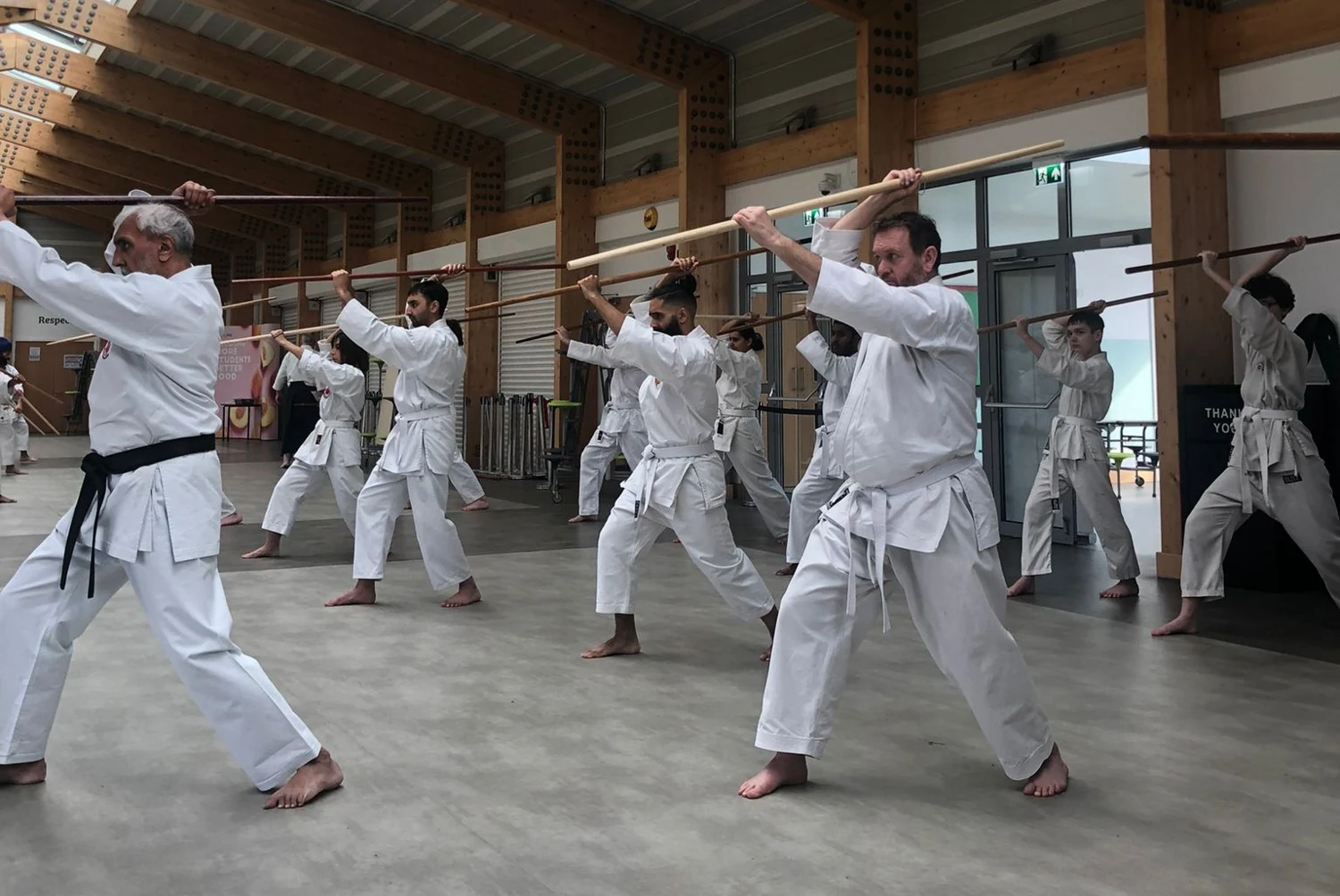 Practitioners studying Bo kata together