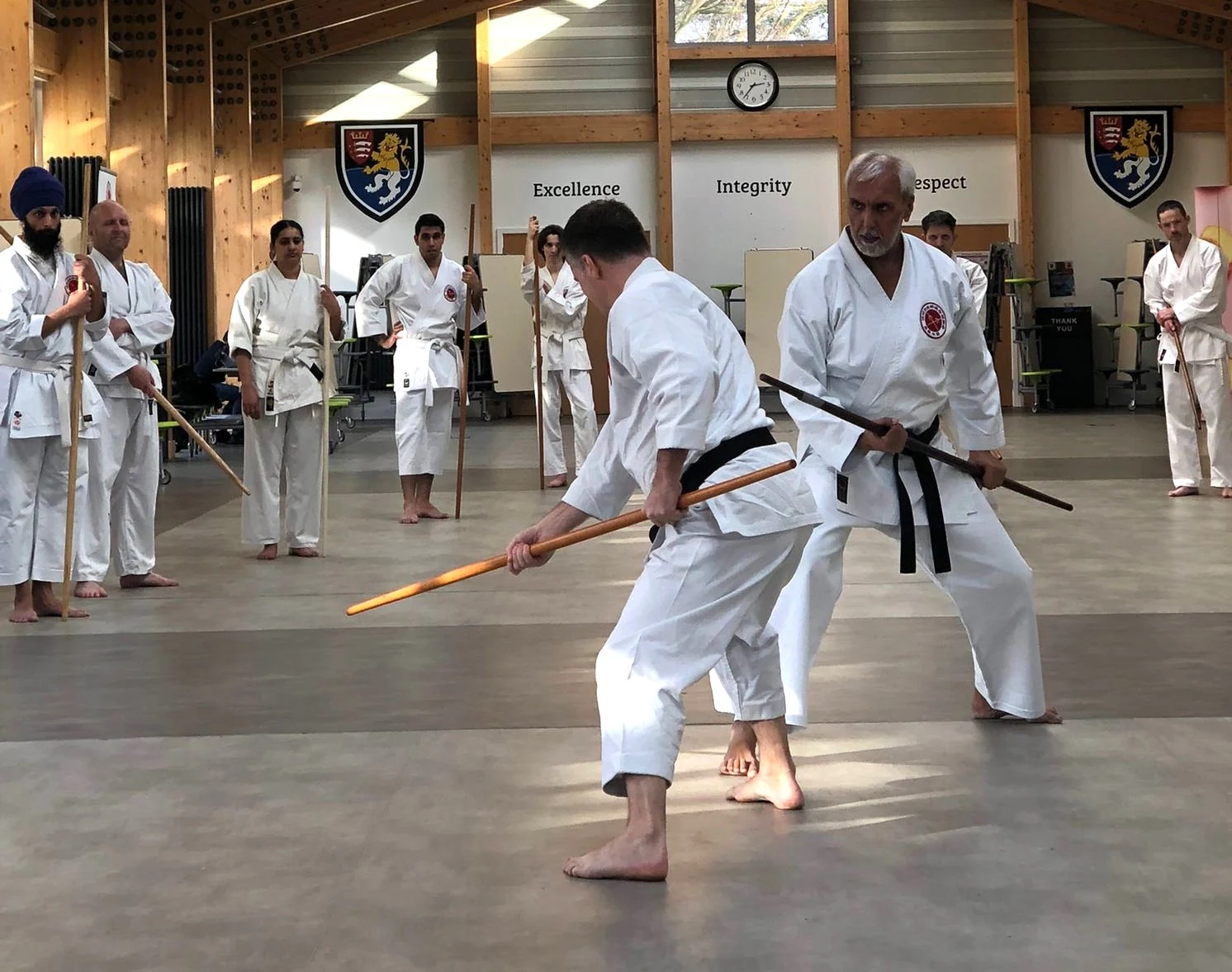 Two practitioners studying Bo distance and timing