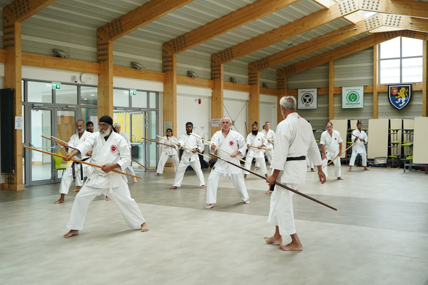 A group learning Bo together with their instructor